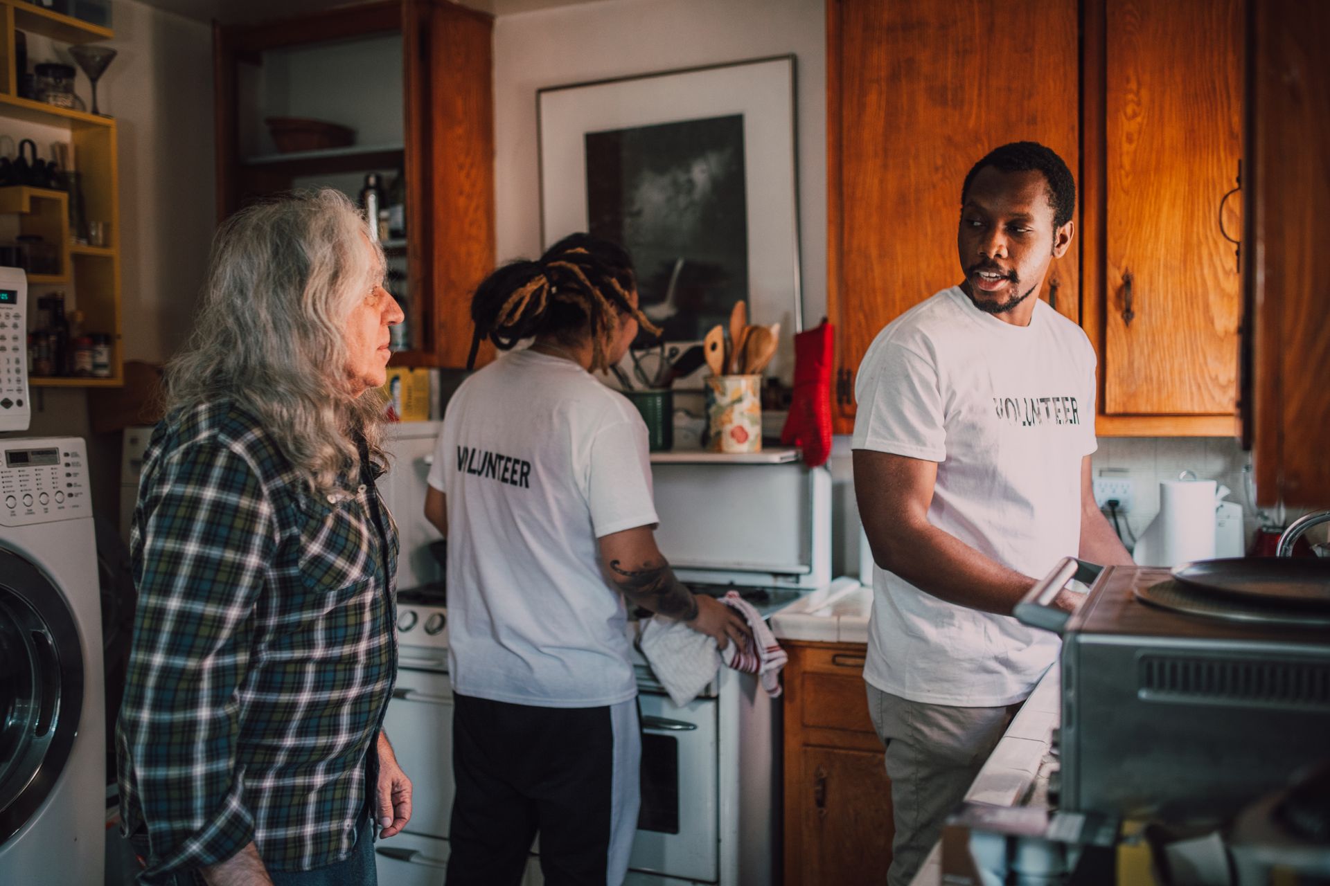 Volunteers preparing food in a community kitchen