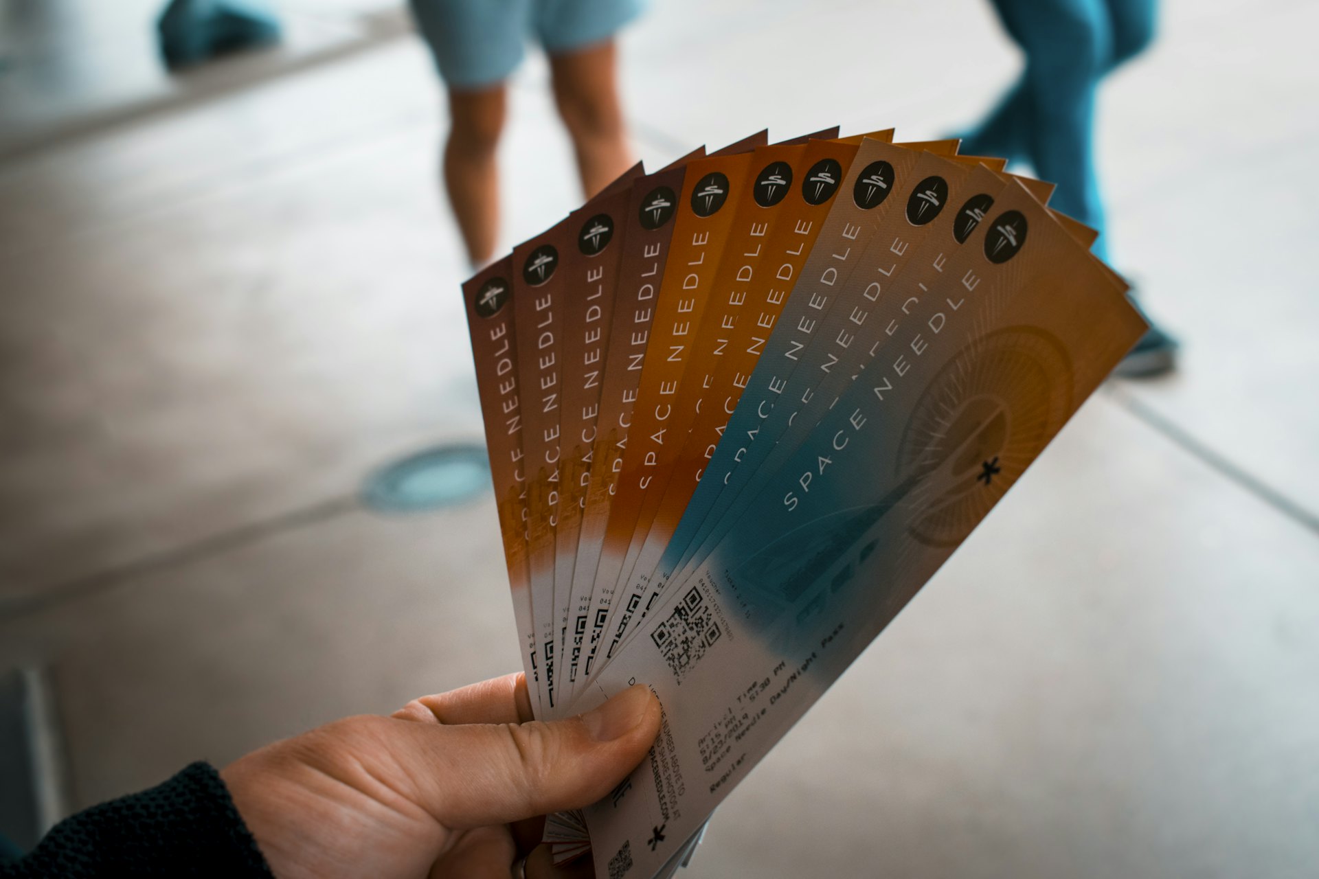 Hand holding a fan of raffle tickets