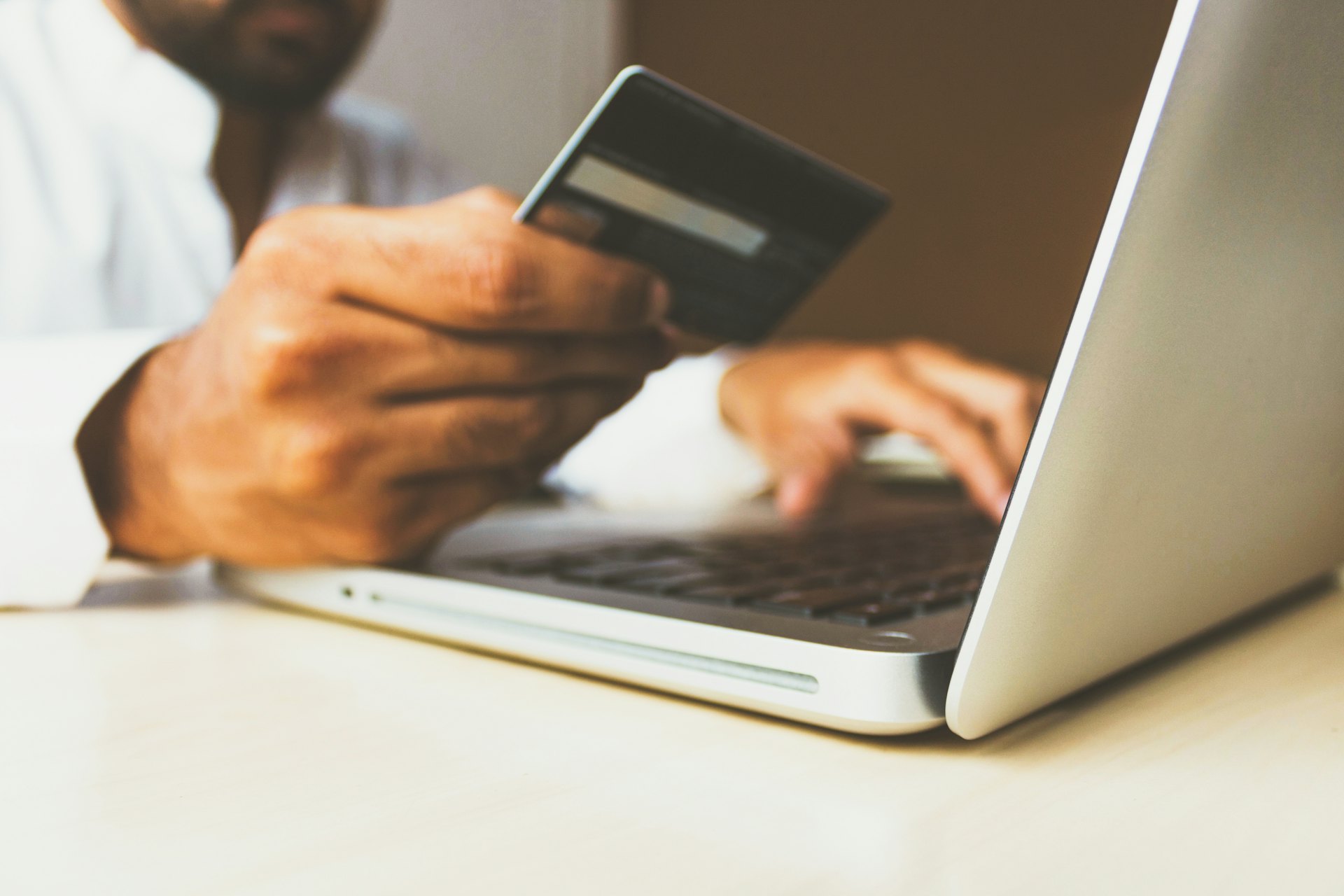 Direct Debit Prcoessing Man with glasses on Direct Debit Processing on tablet